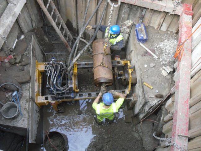 Adding to the auger chain during Phase 2 of the bore to upsize the pilot bore to diameter of the final pipe.